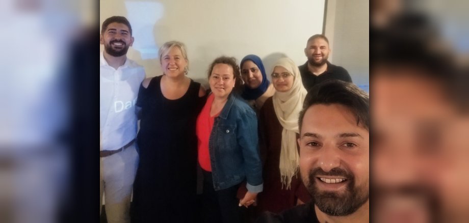 Gruppenfoto 5. Sitzung es Ausländerbeirats Gruppenfoto mit drei Männern und vier Frauen