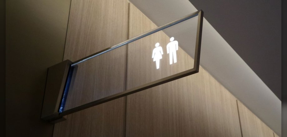 Schild für Toilette mit Icon Mann und Frau